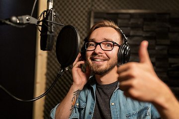 Image showing man with headphones at music recording studio