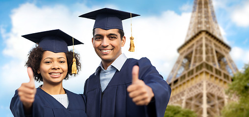 Image showing bachelors showing thumbs up over eiffel tower