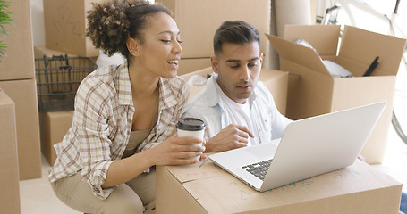 Image showing Young mixed race couple using laptop