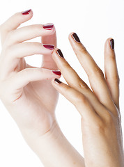 Image showing two different nathion manicured hands on white isolated, african with caucasian close up