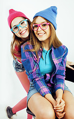 Image showing lifestyle people concept: two pretty stylish modern hipster teen girl having fun together, happy smiling making selfie