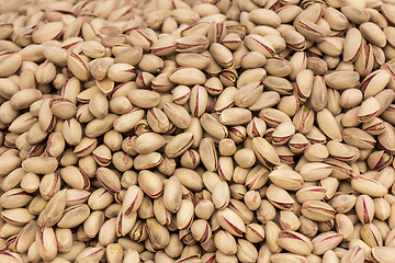 Image showing Roasted and salted pistachios as background