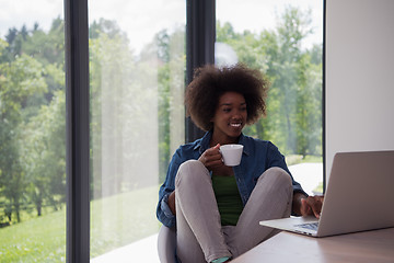 Image showing African American woman in the living room