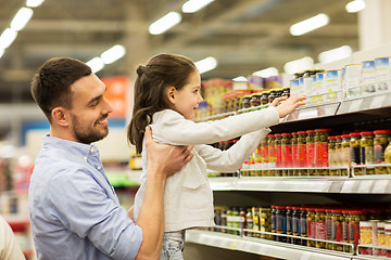 Image showing father with child buying food at grocery store