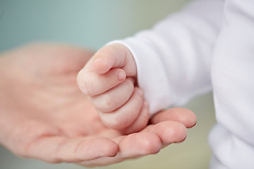 Image showing close up of mother and newborn baby hands