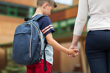 Image showing elementary student boy with mother at school yard