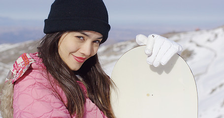 Image showing Beautiful asian girl with snowboard