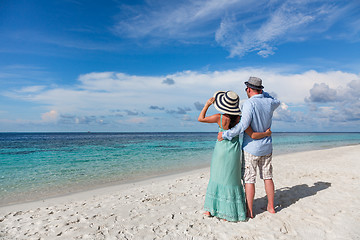 Image showing Vacation Couple walking on tropical beach Maldives.