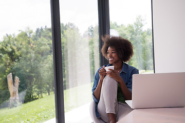 Image showing African American woman in the living room