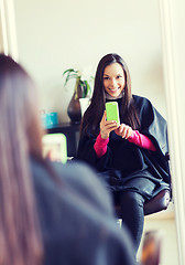 Image showing happy young woman at hair salon