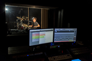 Image showing man playing drum kit at sound recording studio