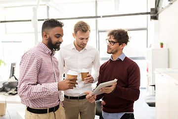 Image showing business team with tablet pc and coffee at office