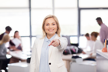 Image showing smiling businesswoman at office