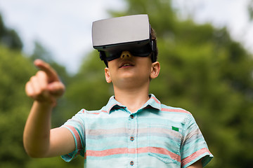 Image showing boy with virtual reality headset outdoors