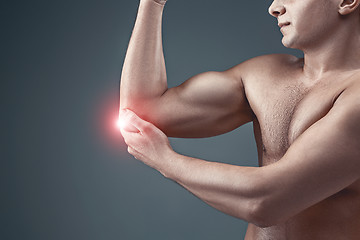 Image showing Man With Pain In Elbow. Pain relief concept