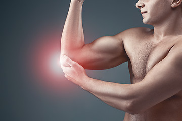 Image showing Man With Pain In Elbow. Pain relief concept