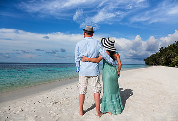 Image showing Vacation Couple walking on tropical beach Maldives.