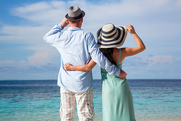 Image showing Vacation Couple walking on tropical beach Maldives.