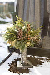 Image showing Flower arrangement at a grave