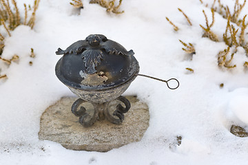 Image showing Holy water shell at a grave   