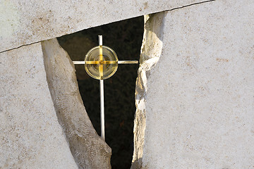 Image showing Golden cross in a grave stone