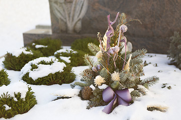 Image showing Flower arrangement at a grave