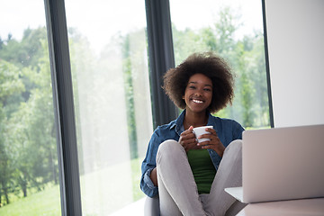 Image showing African American woman in the living room