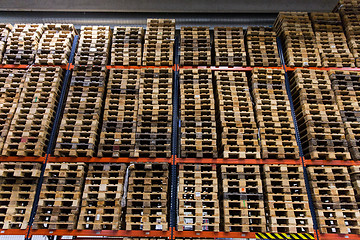 Image showing wooden cargo pallets storing at warehouse shelves