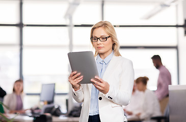 Image showing businesswoman with tablet pc at office
