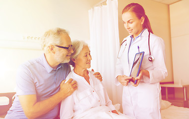 Image showing senior woman and doctor with tablet pc at hospital