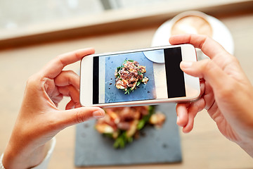 Image showing hands with smartphone photographing food