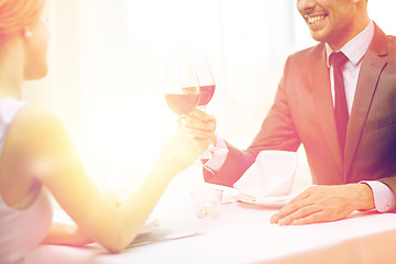 Image showing happy couple with glasses of wine at restaurant