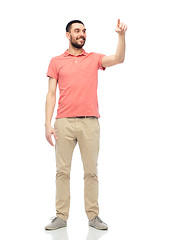 Image showing happy man touching something imaginary