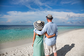 Image showing Vacation Couple walking on tropical beach Maldives.