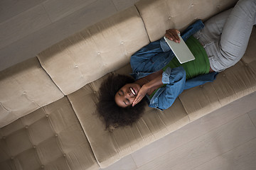 Image showing african american woman at home with digital tablet top view
