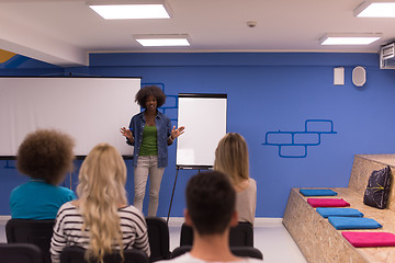 Image showing Black woman Speaker Seminar Corporate Business Meeting Concept