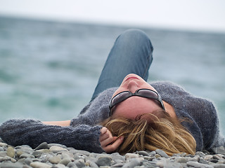Image showing Young lady on Beach Resting
