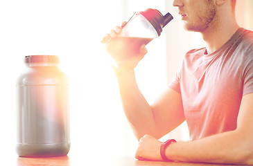 Image showing close up of man drinking protein shake