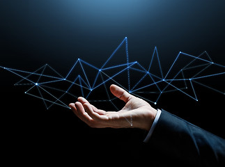 Image showing close up of businessman hand with hologram