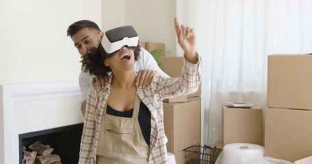 Image showing Happy young couple doing Virtual tour in new apartment