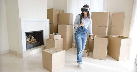 Image showing Young woman using a virtual reality headset