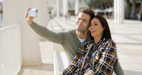 Image showing Happy laughing couple taking their selfie