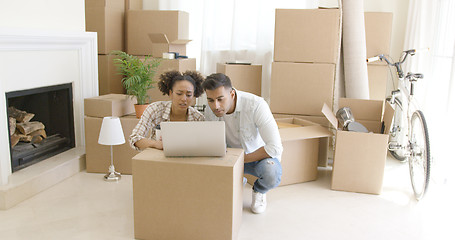 Image showing Young black couple moving into their new home