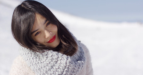 Image showing Happy cute asian girl enjoying her winter time