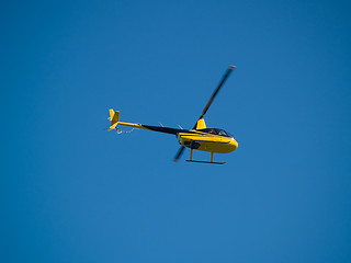 Image showing Small private Helicopter in Sky