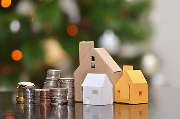 Image showing Paper house and stacks of coins standing