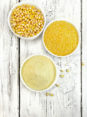 Image showing Flour and grits corn in bowls on board top