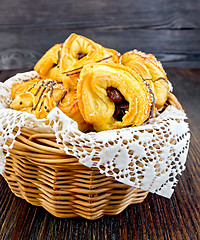 Image showing Cookies with dates in basket on board