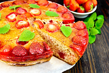 Image showing Pie strawberry with jelly on dark board