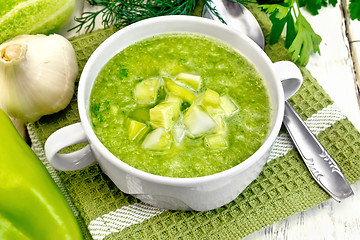 Image showing Soup cucumber in white bowl on board